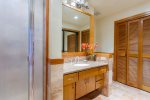 Guest bath houses washer/dryer, sink, toilet, shower and large closet